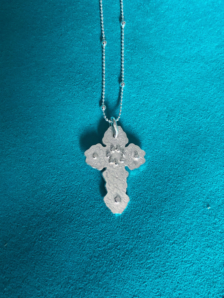 floral inspired cross pendant